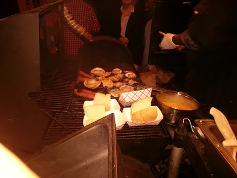 Char grilled oysters and sausage