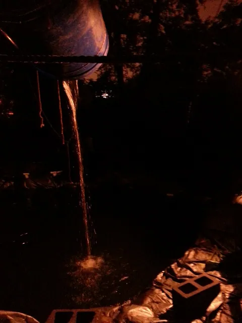 They dug a huge pit and had a water slide that would dump you in the water pit